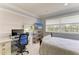 Inviting bedroom with a work desk and a neutral color scheme at 8963 Fishermens Bay Dr, Sarasota, FL 34231
