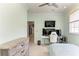 Bedroom featuring office area and desk with computer and monitors at 8963 Fishermens Bay Dr, Sarasota, FL 34231