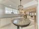 The dining area is bright with natural light and a decorative light fixture at 8963 Fishermens Bay Dr, Sarasota, FL 34231