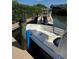 Dock view featuring multiple boats harbored in a waterway, presenting waterfront lifestyle at 8963 Fishermens Bay Dr, Sarasota, FL 34231