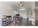 Bright home office featuring hardwood floors, a ceiling fan, large windows and office desk at 8963 Fishermens Bay Dr, Sarasota, FL 34231