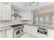 Bright kitchen features stainless steel appliances, marble countertops, and open layout at 8963 Fishermens Bay Dr, Sarasota, FL 34231