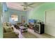 Inviting living room with comfortable sofa, modern TV, and stylish décor, perfect for relaxing or entertaining guests at 8963 Fishermens Bay Dr, Sarasota, FL 34231
