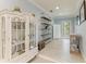 Bright living room features a decorative hutch, and outdoor access at 8963 Fishermens Bay Dr, Sarasota, FL 34231