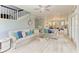 Bright living room boasts a glass table, comfortable seating, and plenty of natural light at 8963 Fishermens Bay Dr, Sarasota, FL 34231