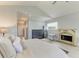The main bedroom suite has a cozy fireplace and views of the hallway at 8963 Fishermens Bay Dr, Sarasota, FL 34231
