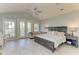 The main bedroom suite features a seating area and balcony access at 8963 Fishermens Bay Dr, Sarasota, FL 34231
