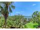 Scenic view overlooking lush green foliage and a tranquil waterway at 8963 Fishermens Bay Dr, Sarasota, FL 34231