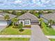 Aerial view of a single Gathering home with an oversized driveway at 926 Fernleaf Run, Bradenton, FL 34212