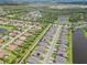 Aerial view of homes situated amongst ponds, rivers and conservation area at 926 Fernleaf Run, Bradenton, FL 34212
