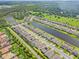 An aerial community view includes ponds, conservation areas and many homes with solar panels at 926 Fernleaf Run, Bradenton, FL 34212