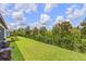Spacious backyard with a beautiful lawn, privacy fence, and mature trees offering a serene outdoor space at 926 Fernleaf Run, Bradenton, FL 34212