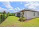 Well-maintained backyard with lush green lawn, partial fence and manicured landscaping at 926 Fernleaf Run, Bradenton, FL 34212