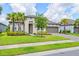 Beautiful home with a well-maintained lawn and landscaping, and a brick paver driveway leading to a two-car garage at 926 Fernleaf Run, Bradenton, FL 34212