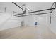 Spacious garage with storage shelves and epoxy flooring at 926 Fernleaf Run, Bradenton, FL 34212