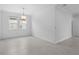 Open-concept room filled with natural light, showing sleek tile floors, and providing lots of space at 926 Fernleaf Run, Bradenton, FL 34212
