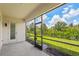 Relaxing screened-in patio offers a view of the lush backyard at 926 Fernleaf Run, Bradenton, FL 34212