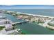 Scenic aerial view of a coastal area, showcasing the bridge and surrounding beachfront at 105 Shore Rd, Nokomis, FL 34275