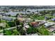Beautiful aerial view of a residential area with a lake and nearby commercial spaces at 105 Shore Rd, Nokomis, FL 34275