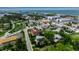 Expansive aerial view of a waterfront community with lush greenery and coastal charm at 105 Shore Rd, Nokomis, FL 34275