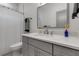 Clean bathroom featuring a gray vanity and shower with white curtain at 105 Shore Rd, Nokomis, FL 34275
