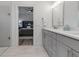 Bathroom features double sinks, white counters, and an adjacent bedroom at 105 Shore Rd, Nokomis, FL 34275