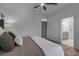Bedroom features neutral color palette, ceiling fan, and ensuite bathroom at 105 Shore Rd, Nokomis, FL 34275