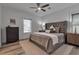 Luxurious bedroom features a large bed with tufted headboard and plush rug at 105 Shore Rd, Nokomis, FL 34275