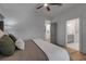 Bedroom features a gray bed, bathroom, and laundry room at 105 Shore Rd, Nokomis, FL 34275