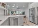 Open kitchen with stainless appliances and quartz countertops, perfect for modern living and entertaining at 105 Shore Rd, Nokomis, FL 34275