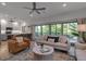 The light and airy living room provides an open view into the kitchen and breakfast bar at 105 Shore Rd, Nokomis, FL 34275
