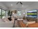 The open living room has stylish decor, light colored couches and plenty of room at 105 Shore Rd, Nokomis, FL 34275