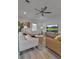 The living room features light wood floors, neutral decor and stylish furniture at 105 Shore Rd, Nokomis, FL 34275