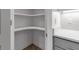 Walk-in pantry with corner shelving offers generous storage space next to the kitchen area at 105 Shore Rd, Nokomis, FL 34275