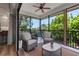 Relaxing screened patio features comfortable seating and views at 105 Shore Rd, Nokomis, FL 34275