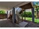Stairway leading to the main floor, located under the stilted house, providing access to the lush backyard at 105 Shore Rd, Nokomis, FL 34275
