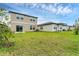 Expansive backyard features lush green lawn at 10611 Ladybug Cv, Parrish, FL 34219