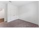 This bedroom boasts wall-to-wall carpeting and double door closet at 10611 Ladybug Cv, Parrish, FL 34219