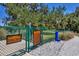 Fenced dog park area with rules sign and pet waste station at 10611 Ladybug Cv, Parrish, FL 34219