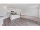 Bright and open kitchen area with an island, stainless steel appliances, and a seamless flow to living spaces at 10611 Ladybug Cv, Parrish, FL 34219