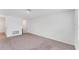 Empty living room featuring neutral carpet, bright walls, and good lighting at 10611 Ladybug Cv, Parrish, FL 34219
