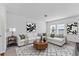 Bright living room with modern decor, a comfortable sectional sofa, and stylish accents at 10611 Ladybug Cv, Parrish, FL 34219