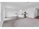 Spacious living space featuring a bright kitchen and an adjacent living area for versatile use at 10611 Ladybug Cv, Parrish, FL 34219