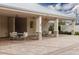 Covered poolside seating area with tables and chairs for residents at 10611 Ladybug Cv, Parrish, FL 34219