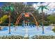 Community splash pad with water features and palm tree accents at 10611 Ladybug Cv, Parrish, FL 34219