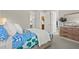 Bright bedroom featuring a patterned bedspread and natural wood accents at 12139 Cranston Way, Bradenton, FL 34211