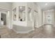 Hallway with wood-look tile flooring, recessed lighting, and architectural details at 12139 Cranston Way, Bradenton, FL 34211