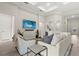 Inviting living room featuring comfortable seating, modern decor, and a mounted television at 12139 Cranston Way, Bradenton, FL 34211