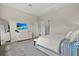 Comfortable bedroom featuring ample natural light, stylish decor, and wood-look floors at 12139 Cranston Way, Bradenton, FL 34211