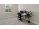 Bright office features a modern desk setup, comfortable chair, and natural light from the window at 12139 Cranston Way, Bradenton, FL 34211